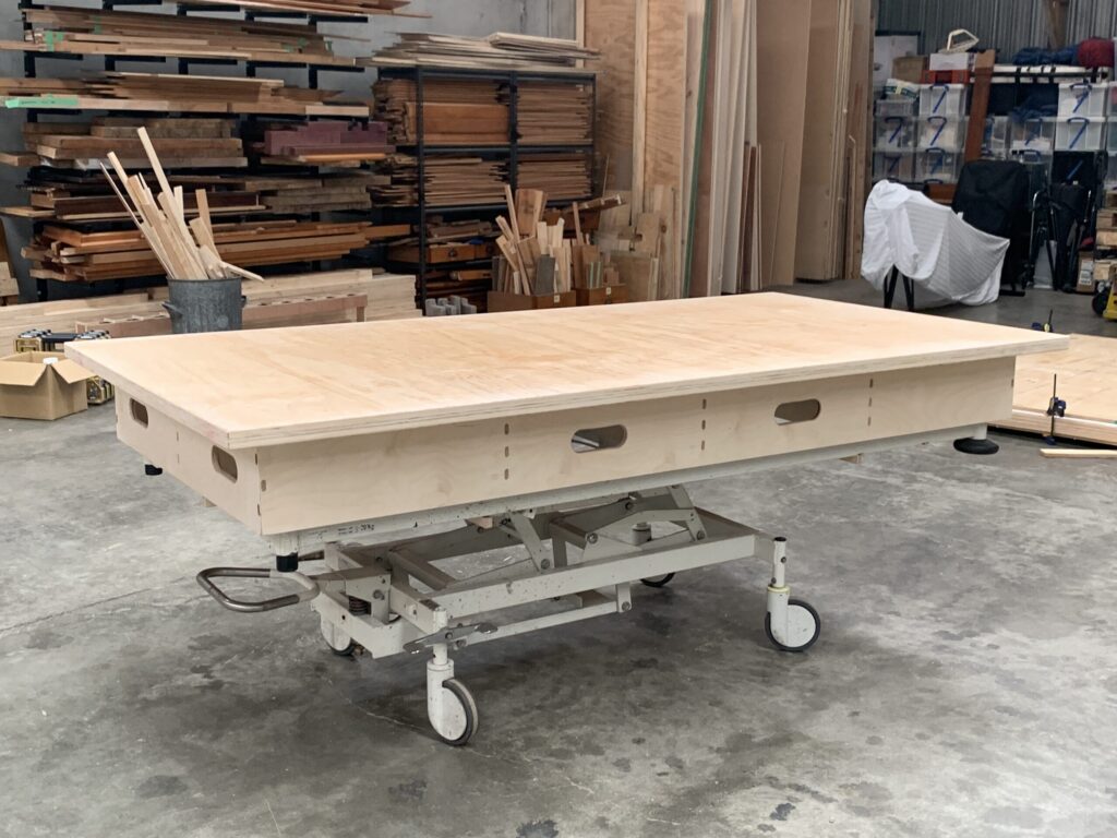 Hospital bed, converted to a portable height adjustable workbench
